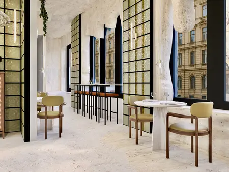 Wnętrze restauracji w stylu japandi i minimalistycznym z jasnymi meblami.