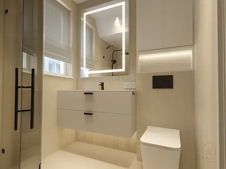 Minimalistyczna łazienka z nowoczesnymi akcentami i oświetleniem LED.