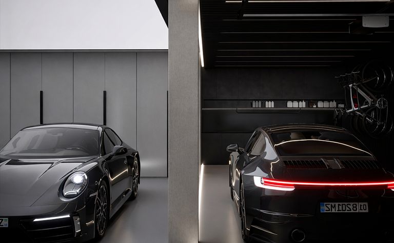 Nowoczesny garaż z dwoma czarnymi samochodami i oświetleniem LED, quiet luxury
