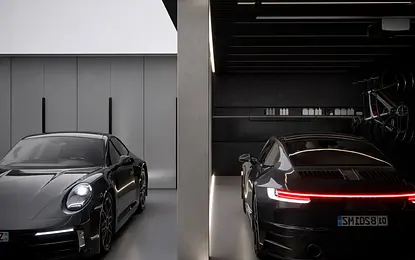 Nowoczesny garaż z dwoma czarnymi samochodami i oświetleniem LED, quiet luxury