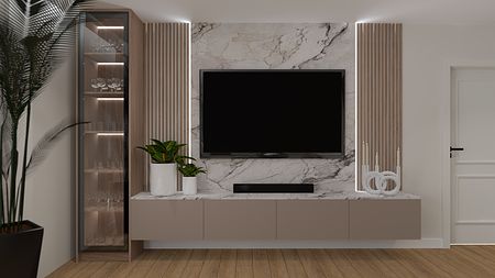 Wnętrze z telewizorem na ścianie, beżową szafką i roślinnością.