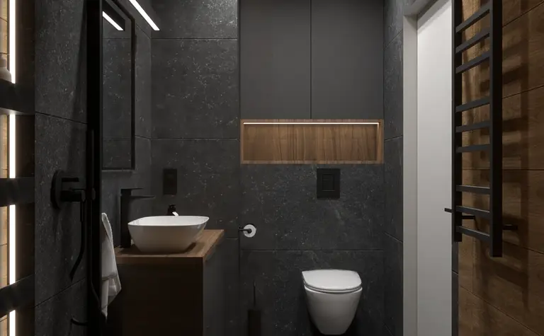 Wnętrze nowoczesnej łazienki w stylu soft minimalizm z czarnymi płytkami i drewnem.
