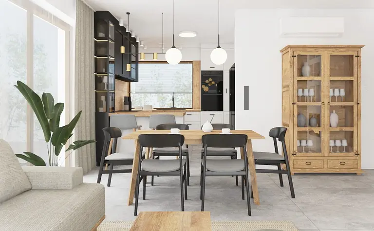 Wnętrze kuchni z drewnianym stołem, szarymi krzesłami oraz roślinami. Styl boho i eklektyczny.