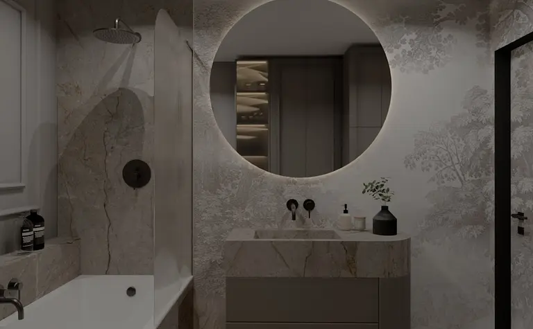 Nowoczesna łazienka z wanną, okrągłym lustrem i eleganckim wykończeniem.