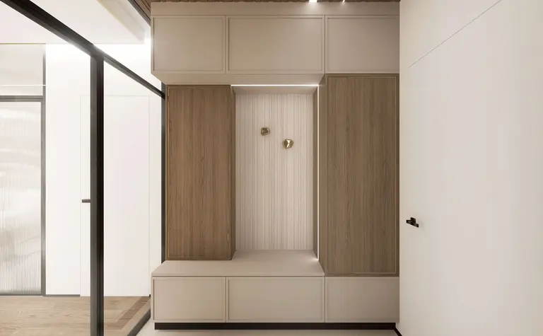 Minimalistyczny przedpokój z drewnianymi szafkami i jasnym tłem, nowoczesny design.