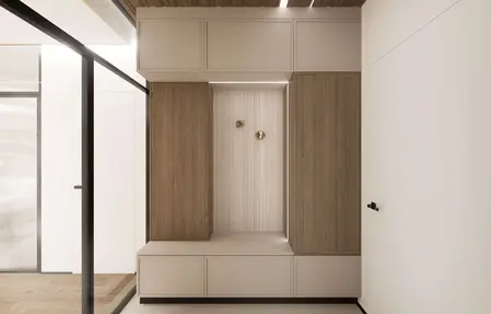 Minimalistyczny przedpokój z drewnianymi szafkami i jasnym tłem, nowoczesny design.