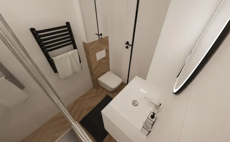 Nowoczesna łazienka z minimalistycznym wystrojem, białą umywalką i drewnianą podłogą.