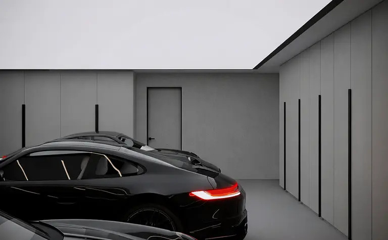 Nowoczesny garaż z czarnymi samochodami i jasnym sufitem, styl quiet luxury.