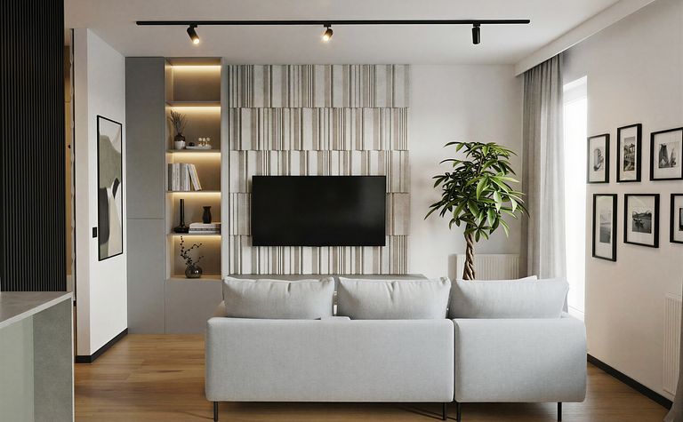 Wnętrze salonu z szarym narożnikiem, drewnianą podłogą i rośliną – styl industrialny i minimalistyczny.