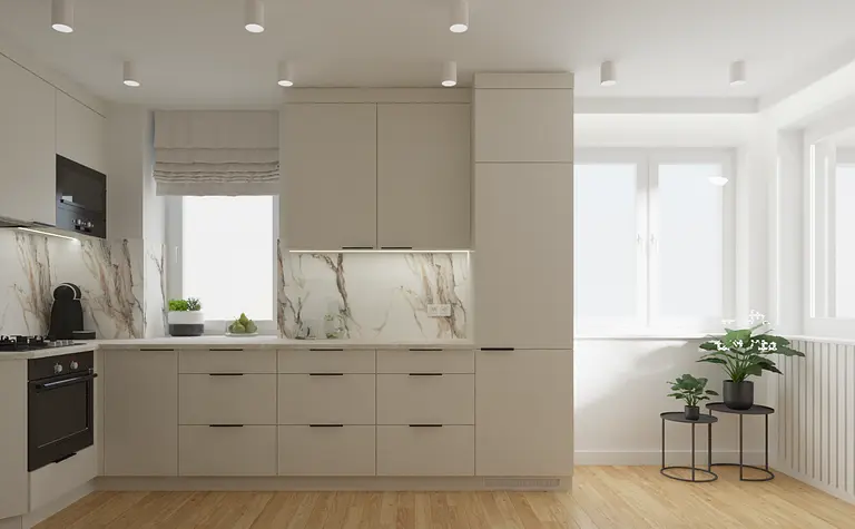 Wnętrze kuchni z beżowymi meblami i marmurowym blatem, nowoczesny design.