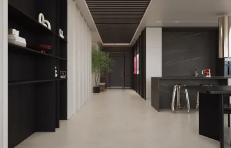 Wnętrze nowoczesnej kuchni z minimalistycznym designem, czarnymi meblami i jasnym blatem.