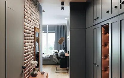 Przedpokój w stylu industrialnym i soft minimalizm z drewnianą podłogą i szafkami.