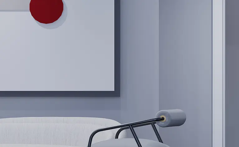 Nowoczesne wnętrze w stylu japandi z szarym fotelem, białą sofą i minimalistycznymi akcentami.