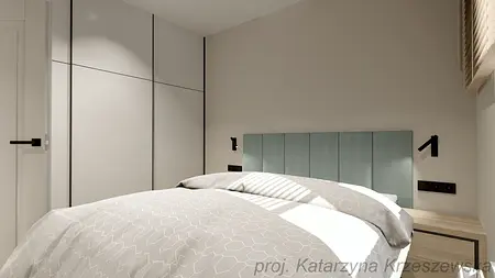Sypialnia w stylu industrialnym, minimalistycznym i współczesnym z szarymi ścianami i niebieskim wezgłowiem.
