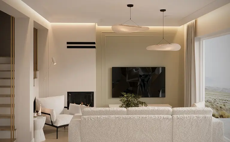 Wnętrze salonu z białą sofą, eklektycznymi akcentami i boho detalami.