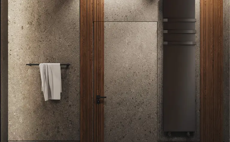 Nowoczesna łazienka z szarymi ścianami, drewnianymi detalami, minimalistyczny design.