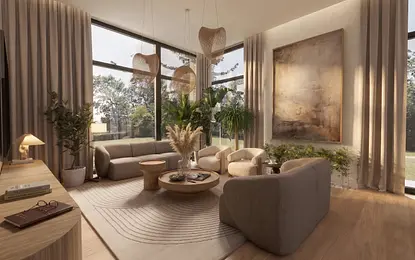 Wnętrze salonu w stylu boho i japandi z jasnymi meblami i roślinami.