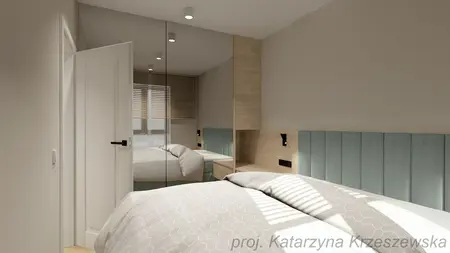 Nowoczesna sypialnia z lustrzaną szafą, minimalistycznymi akcentami i jasnym wnętrzem.