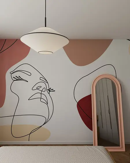 Eklektyczne wnętrze z nowoczesnym oświetleniem i współczesną grafiką na ścianie.