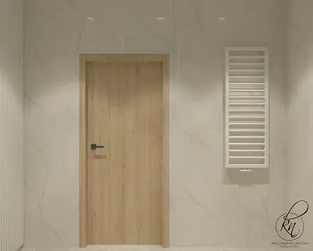 Minimalistyczny hol z drewnianymi drzwiami i białymi ścianami.
