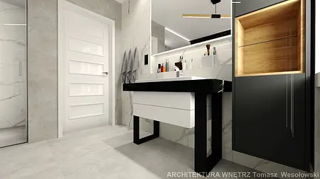 Nowoczesna łazienka minimalistyczna z białą umywalką i czarnymi detalami.