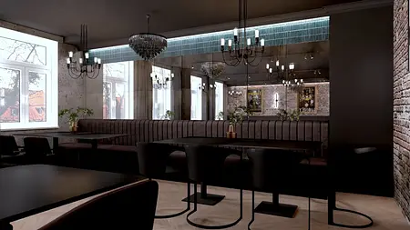 Wnętrze restauracji w stylu industrialnym z ciemnymi meblami i dużymi lustrami.