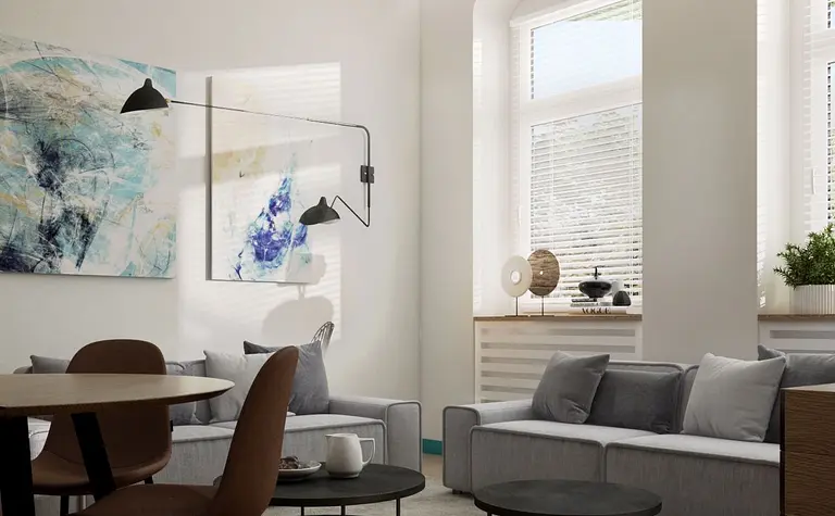 Nowoczesny salon w stylu eklektycznym z szarymi kanapami, okrągłymi stolikami i dużymi oknami.