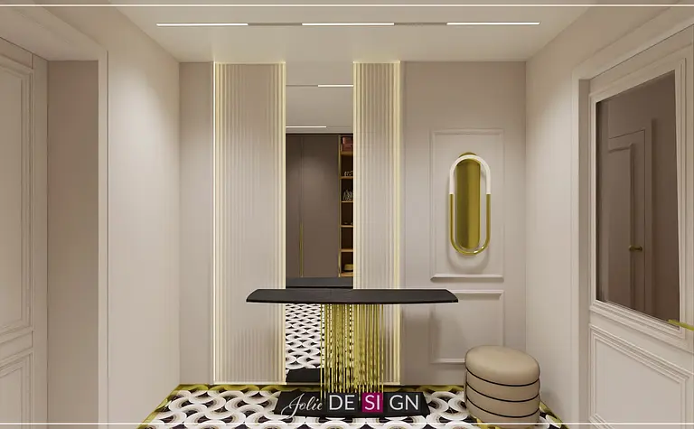 Przedpokój w stylu art deco z czarnym stolikiem i złotymi akcentami.
