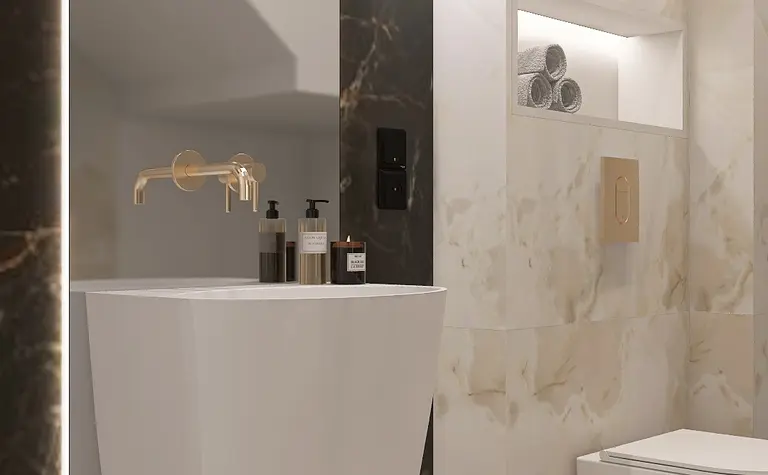 Nowoczesna łazienka z minimalistycznym designem, białą umywalką i eleganckimi akcentami.
