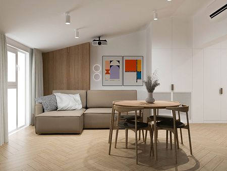 Nowoczesne wnętrze z minimalistyczną kanapą i drewnianym stołem, idealne do małego salonu.