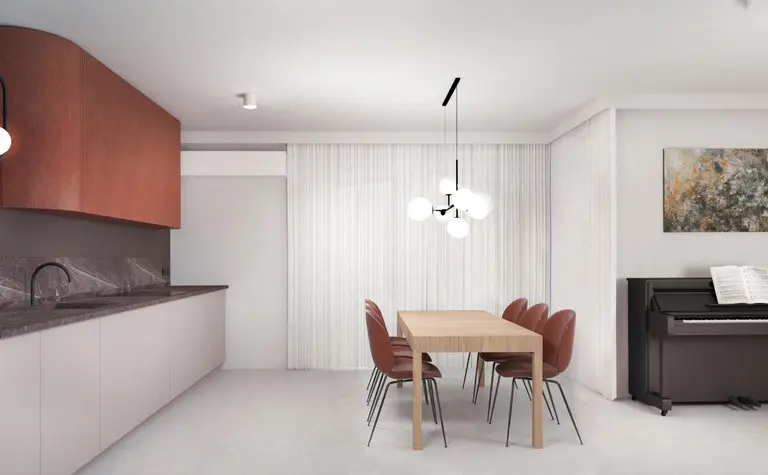 Wnętrze jadalni z minimalistycznym wystrojem, drewnianym stołem i nowoczesnymi krzesłami.
