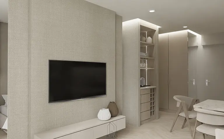 Wnętrze w stylu soft minimalizm z telewizorem, jasnymi meblami i drewnianymi detalami.