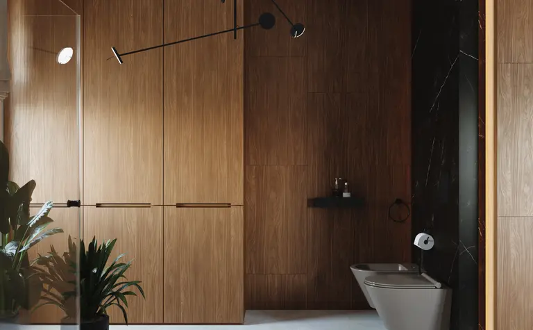 Wnętrze łazienki z minimalistycznym designem, drewniane wykończenia i roślinność.