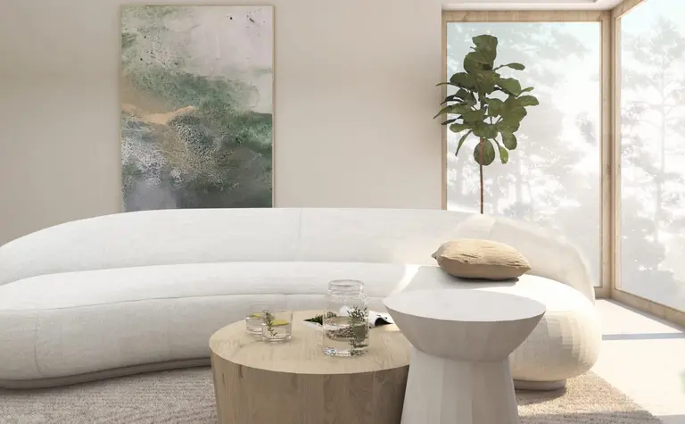 Wnętrze salonu w stylu japandi z minimalistycznymi meblami i nowoczesnym oświetleniem.