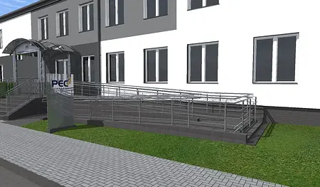 Wejście do budynku z rampą, zieloną trawą i nowoczesnymi detalami. Styl industrialny i minimalistyczny.