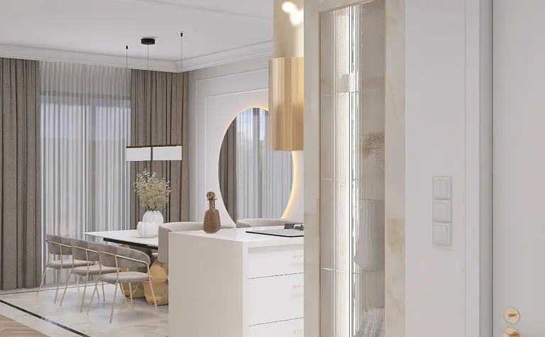 Nowoczesne wnętrze kuchni z białymi meblami, złotymi detalami i minimalistycznym designem.