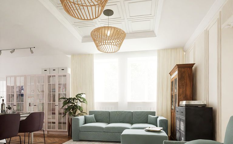 Wnętrze salonu w stylu boho, eklektycznym i skandynawskim z niebieskimi sofami.
