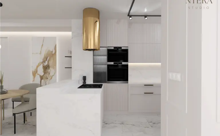 Nowoczesna kuchnia w stylu art deco i minimalistycznym z marmurowymi detalami.