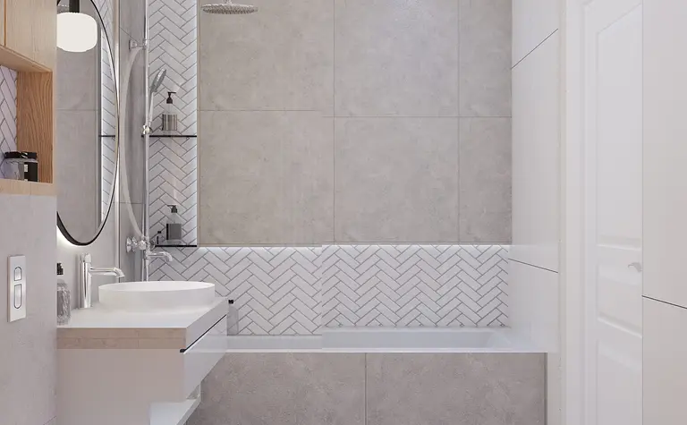 Łazienka w stylu art deco, glamour i nowoczesnym z szarymi płytkami i białym wyposażeniem.