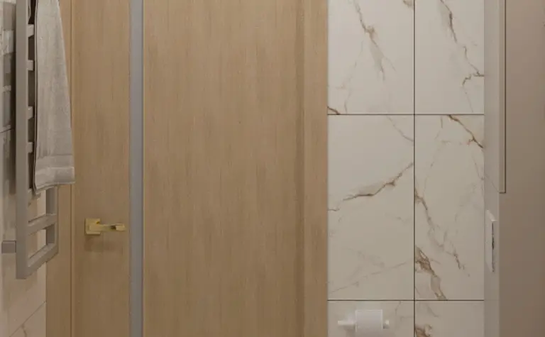 Wnętrze łazienki w stylu japandi i minimalistycznym z jasnymi płytkami.