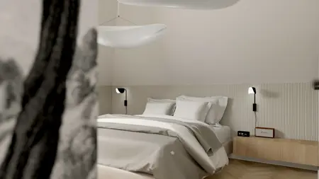 Wnętrze sypialni w soft minimalizmie z tradycyjnym i współczesnym stylem.