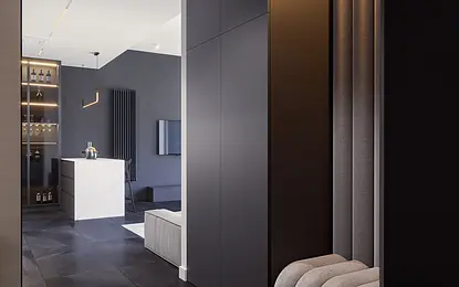 Nowoczesny przedpokój z minimalistycznym wystrojem, szarymi ścianami i stylowymi akcentami.