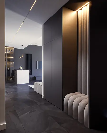 Nowoczesny przedpokój z minimalistycznym wystrojem, szarymi ścianami i stylowymi akcentami.