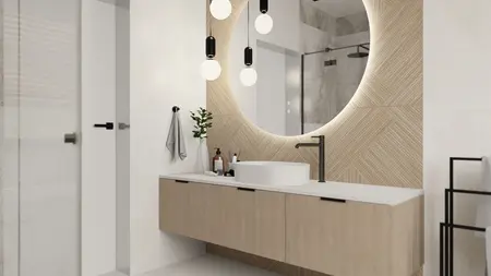 Wnętrze nowoczesnej łazienki z drewnianą szafką, dużym lustrem i eleganckimi akcentami.