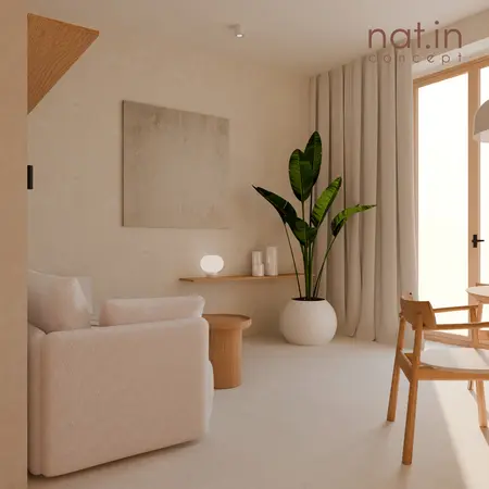 Wnętrze salonu w stylu japandi z beżową sofą, rośliną i drewnianymi akcentami.