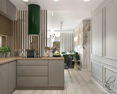 Wnętrze kuchni z zielonym okapem, drewnianymi detalami i nowoczesnym stylem.