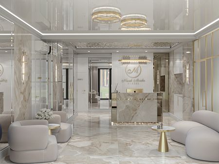 Wnętrze recepcji z marmurową podłogą i jasnymi meblami w stylu glamour.