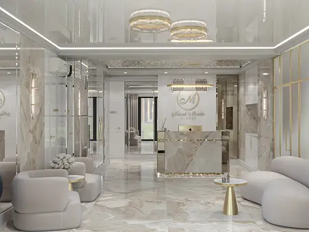 Wnętrze recepcji z marmurową podłogą i jasnymi meblami w stylu glamour.