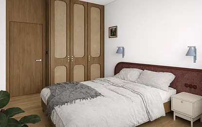 Sypialnia z brązową szafą, szarym łóżkiem i vintage dekoracjami w stylu dopamine decor.