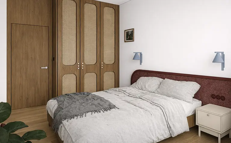 Sypialnia z brązową szafą, szarym łóżkiem i vintage dekoracjami w stylu dopamine decor.